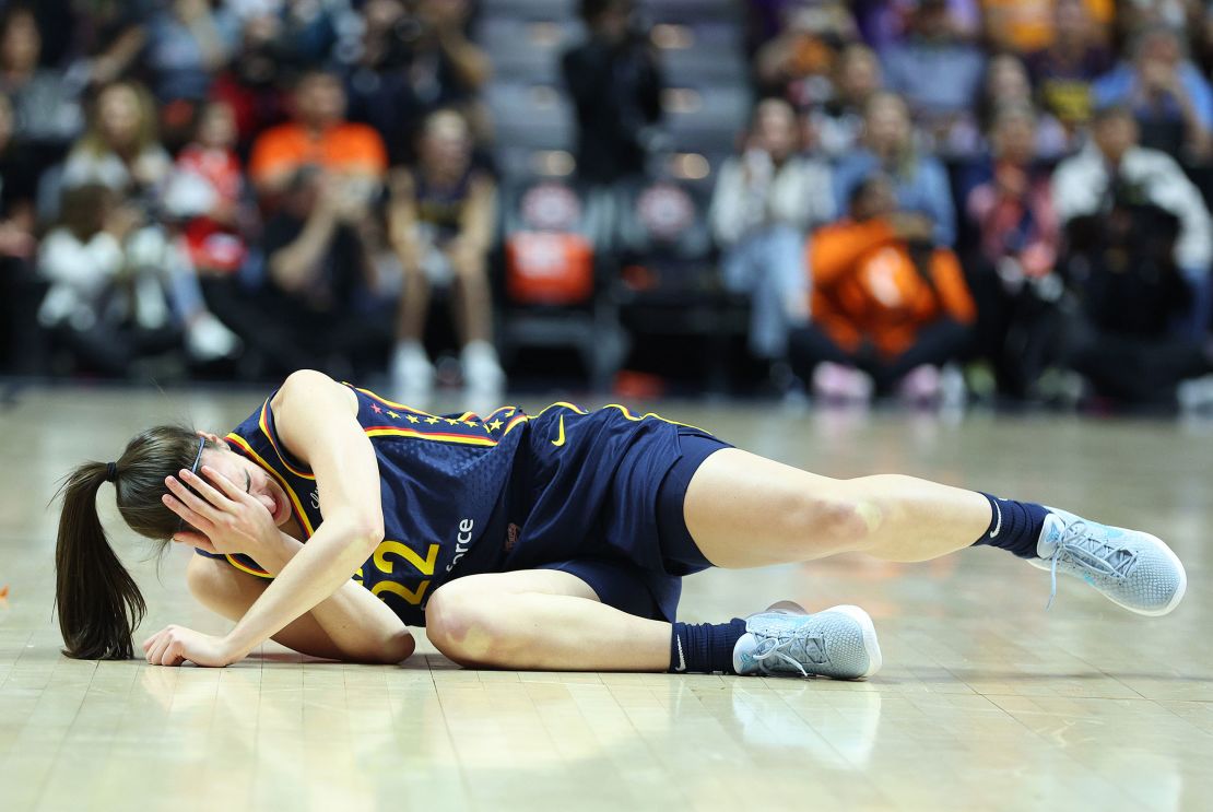 Indiana Fever guard Caitlin Clark reacts after getting hit in the eye during Game 1 of the 2024 WNBA playoffs between Indiana Fever and Connecticut Sun.