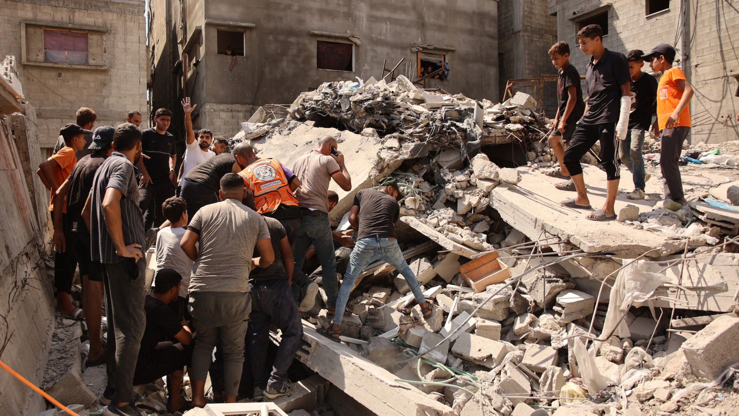 Palestinians search for survivors amids the rubble of a building, which collapsed after Israeli bombardment on a building adjacent to it, in the Sheikh Radwan neighbourhood in Gaza City on September 23, 2024, amid the ongoing war between Israel and the militant Hamas group.