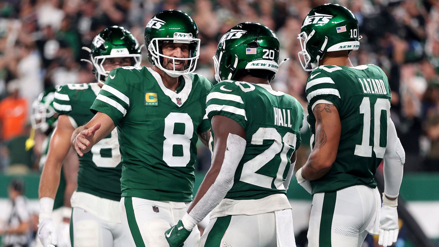 Aaron Rodgers (No. 8) threw two touchdowns on his return to action at MetLife Stadium as the New York Jets beat the New England Patriots.