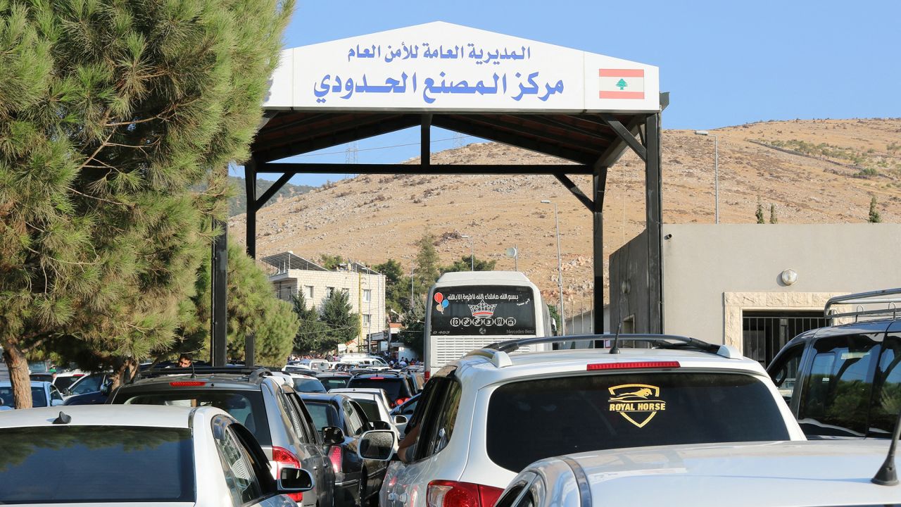 People fleeing Israeli bombings in Lebanon wait to cross the border with Syria through the Masnaa crossing is eastern Lebanon, on September 24.