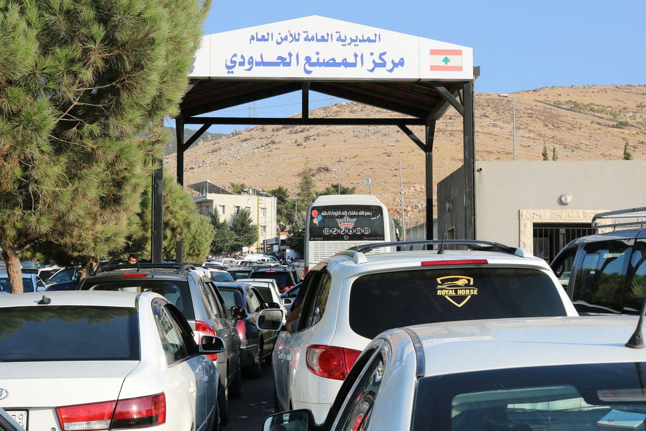 People fleeing Israeli bombings in Lebanon wait to cross the border with Syria through the Masnaa crossing is eastern Lebanon, on September 24.