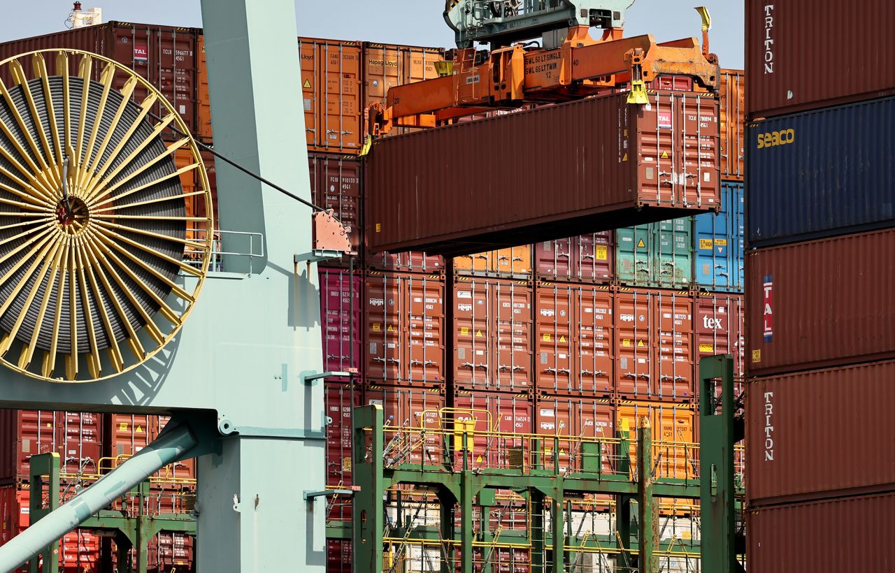 A shipping container is offloaded from a vessel at the Port of Los Angeles on September 20.