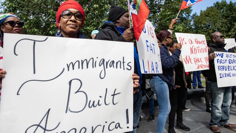 People participate in a rally in solidarity with the Haitian community at Boston Common in Boston on September 24, 2024. Tensions against Haitians have been stoked after an unfounded story of Haitian migrants eating pets went viral on social media, with the Republican ex-president and current White House candidate Donald Trump pushing the narrative despite it being debunked. (Photo by Joseph Prezioso / AFP) (Photo by JOSEPH PREZIOSO/AFP via Getty Images)