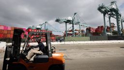 A worker drives a forklift near shipping containers stacked at the Port of Los Angeles on September 20, 2024 in Los Angeles, California. The Port of Los Angeles has seen a 17 percent surge in cargo traffic for the first eight months of the year compared to its 2023 pace amid a looming ports strike.