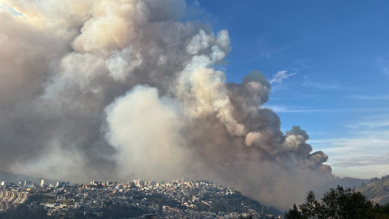 TOPSHOT - Smoke from a wildfire is seen in Quito on September 24, 2024. At least three forest fires were burning simultaneously in Quito, covering it again with smoke and ash, amid a 'water crisis' caused by Ecuador's worst drought in 61 years. (Photo by Galo PAGUAY / AFP) (Photo by GALO PAGUAY/AFP via Getty Images)