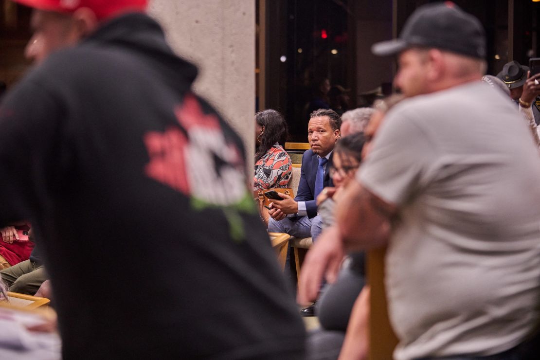 Haitian immigrant and US Navy veteran Jaob Payen listens neighbors in Springfield, Ohio deride Haitian immigrants during a town hall about the 2024 presidential election's focus on the town's influx of Haitian immigrants, on September 24, 2024.