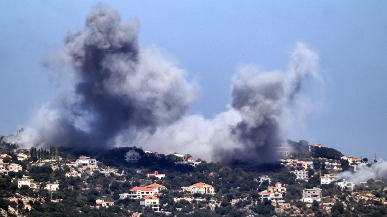 A cloud of smoke erupts during an Israeli air strike on the village of Sujud in southern Lebanon on September 25, 2024. Israel announced dozens of new air strikes on Hezbollah strongholds in Lebanon on September 24, a day after 492 people, including 35 children, were killed in the deadliest bombardment since a devastating war in 2006. (Photo by Rabih DAHER / AFP) (Photo by RABIH DAHER/AFP via Getty Images)