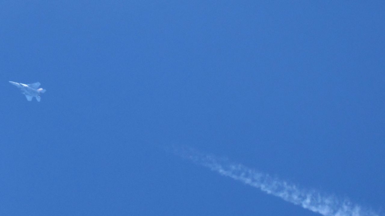 An Israeli fighter jets flies over the northern city of Haifa on September 25, 2024. Israeli warplanes pounded villages in south Lebanon for a third day, Lebanese media reported on September 25, while Israel said it intercepted a missile fired after sirens sounded early morning in Tel Aviv. (Photo by Jack GUEZ / AFP) (Photo by JACK GUEZ/AFP via Getty Images)