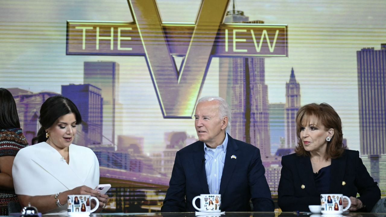 President Joe Biden speaks with hosts Ana Navarro, left, and Joy Behar, right, during a commercial break on ABC's "The View" on Wednesday.