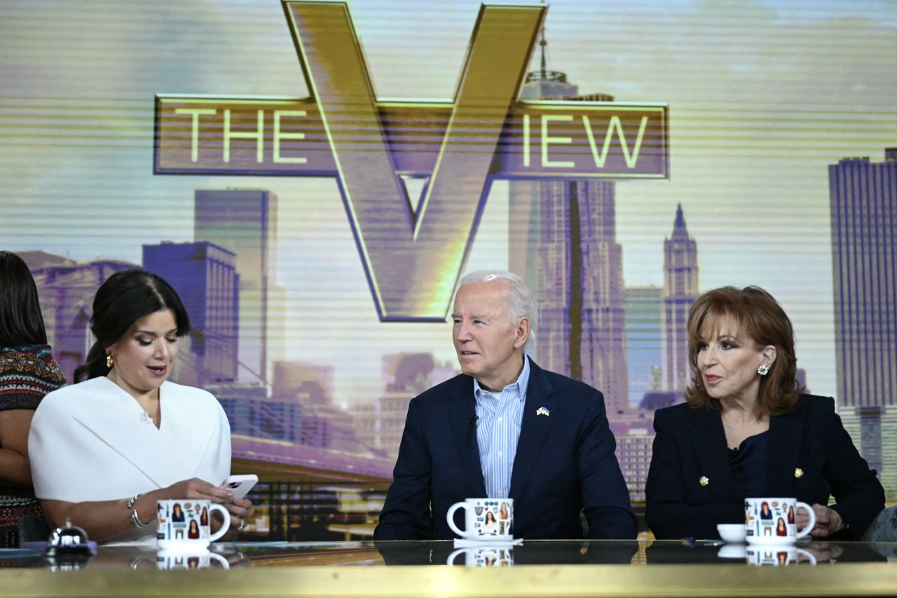 President Joe Biden speaks with hosts Ana Navarro, left, and Joy Behar, right, during a commercial break on ABC's "The View" on Wednesday.