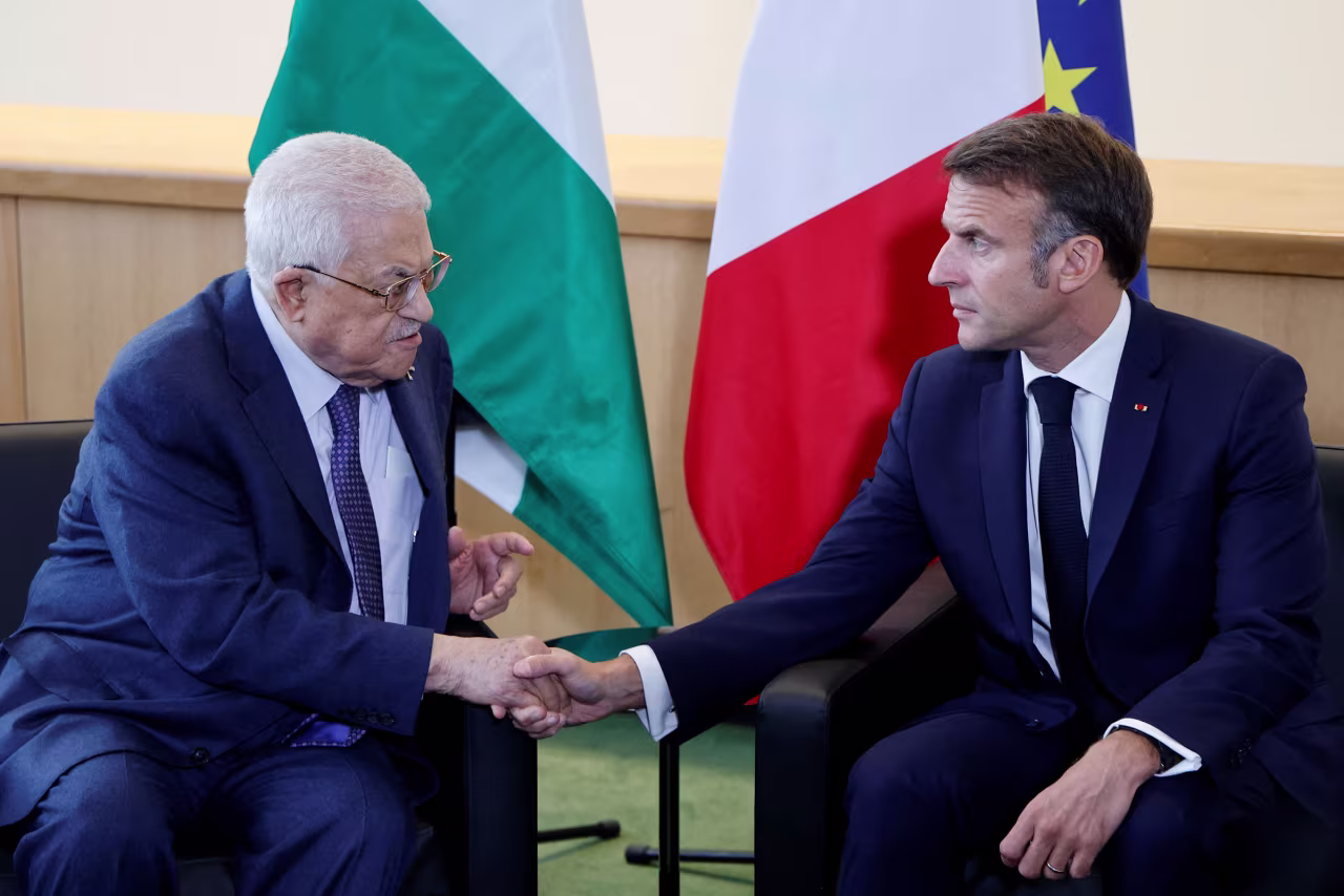 French President Emmanuel Macron shakes hands with Palestinian Authority leader Mahmud Abbas in September 2024, during a meeting on the sidelines of the 79th Session of the United Nations General Assembly in New York.