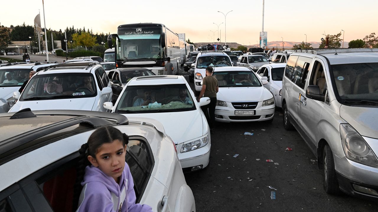 People fleeing from Lebanon arrive on the Syrian side of the border with Lebanon in Jdeidat Yabus in southwestern Syria on September 25.