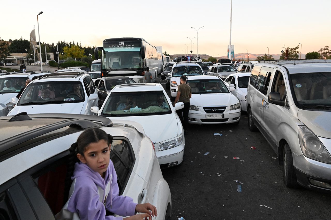 People fleeing from Lebanon arrive on the Syrian side of the border with Lebanon in Jdeidat Yabus in southwestern Syria on September 25.