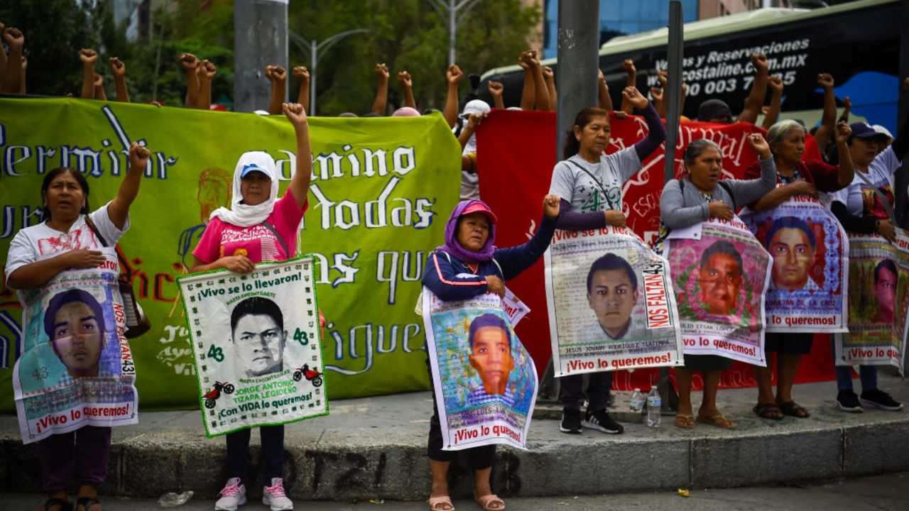 Relatives of the Ayotzinapa victims hold portraits of missing students as they take part in a demonstration at the Paseo de la Reforma avenue to demand justice in the case of the Ayotzinapa missing students in Mexico City on September 25, 2024. Next September 26 marks 10 years since the forced disappearance of 43 students from the Ayotzinapa Rural Normal School. (Photo by Rodrigo Oropeza / AFP) (Photo by RODRIGO OROPEZA/AFP via Getty Images)