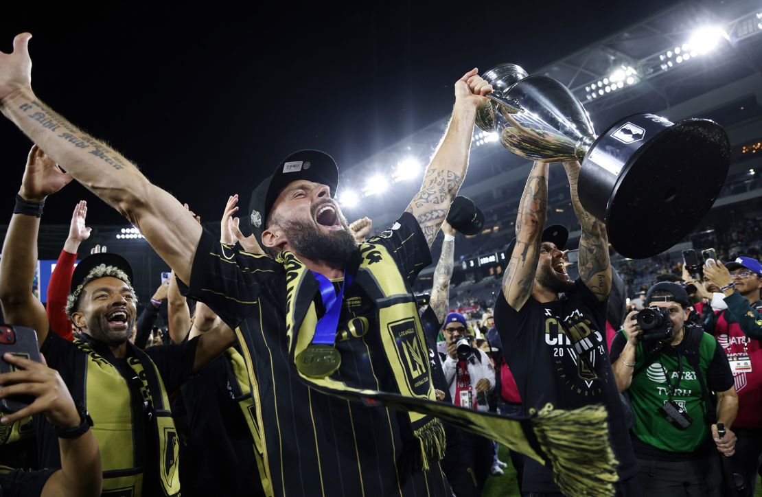 Olivier Giroud hoists the championship trophy after LAFC defeated Sporting Kansas City 3-1 in extra time in the US Open Cup.