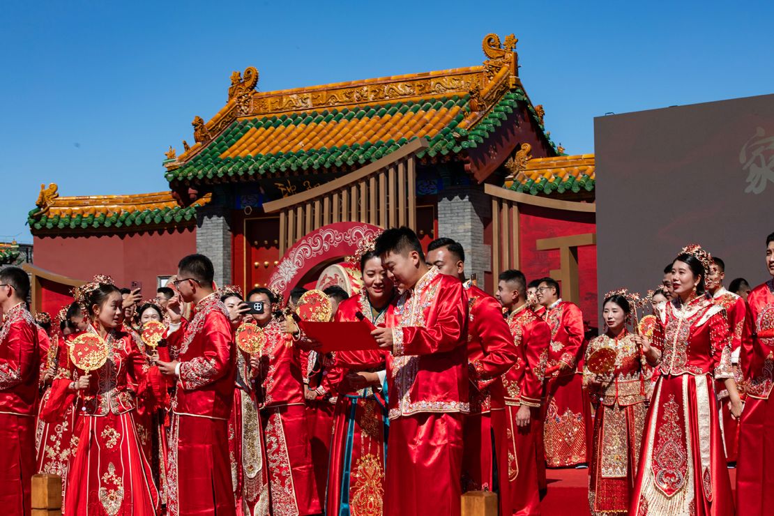 Newlywed couples attend a mass wedding in traditional Chinese style at the Shenyang Imperial Palace in Shenyang, China on September 22, 2024.