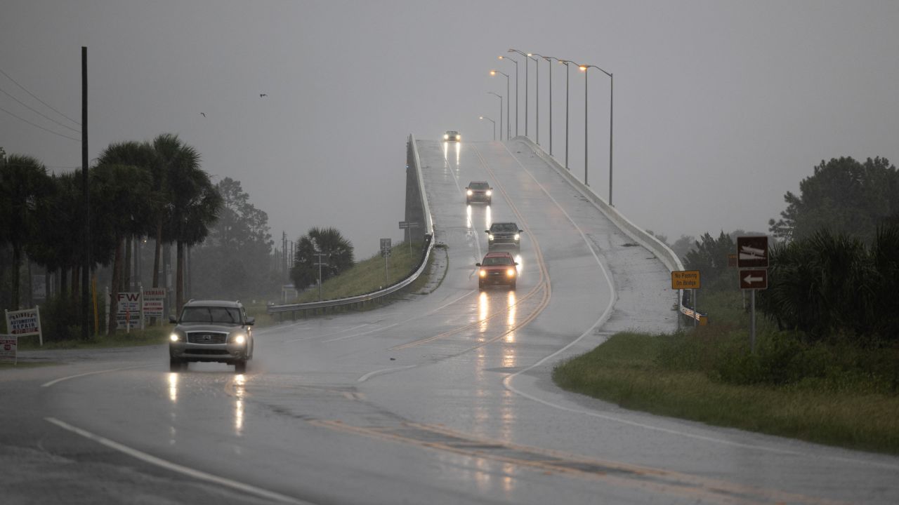 Cars drive over the George G. Tapper Bridge ahead of the arrival of Hurricane Helene in Port Saint Joe, Florida, on September 26.