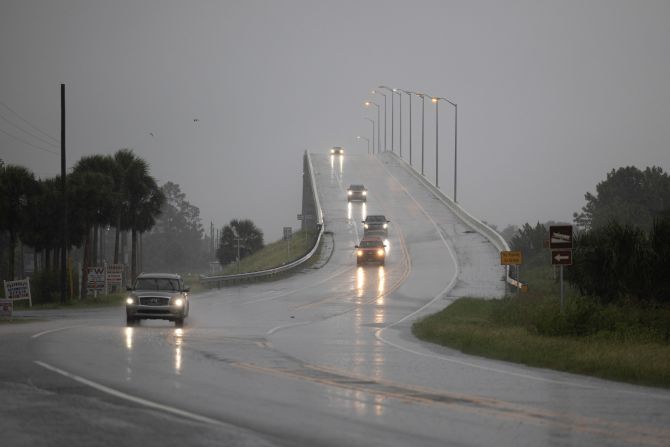 Cars drive over the George G. Tapper Bridge before Hurricane Helene makes landfall in Port Saint Joe, Florida, on Thursday, September 26.