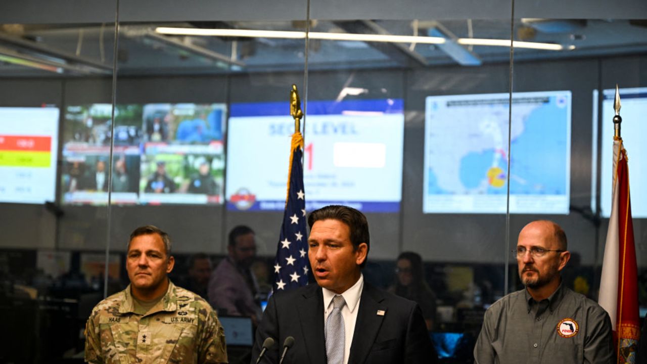 Florida Governor Ron DeSantis speaks during a press conference at the State Emergency Operations Center in Tallahassee, Florida, on September 26, 2024 as Hurricane Helene was set to slam into the Florida coast as a "catastrophic" Category 4 storm. An increasingly powerful hurricane threatening "catastrophic," dangerous storm surges and flooding was forecast to hit Florida's Gulf coast on September 26, as thousands of residents evacuated towns along the US state's shoreline. Helene strengthened into a hurricane mid-morning September 25 in the Gulf of Mexico and is "expected to bring life-threatening storm surge, damaging winds, and flooding rains to a large portion of Florida and the Southeastern United States," the National Hurricane Center in Miami said in its latest bulletin. (Photo by CHANDAN KHANNA / AFP) (Photo by CHANDAN KHANNA/AFP via Getty Images)