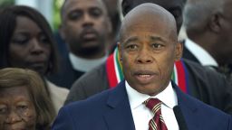 New York City Mayor Eric Adams talks to the press outside  Gracie Mansion, the official residence of the mayor of New York City, on September 26, 2024, after he was indicted on federal criminal charges. US federal agents raided the official residence of Mayor Adams early September 26 ahead of the expected announcement of criminal charges against the former city cop once touted as a rising Democratic Party star. The search at the residence known as Gracie Mansion began before dawn, and is the latest shock twist in a graft investigation against the Adams administration. (Photo by TIMOTHY A. CLARY / AFP)