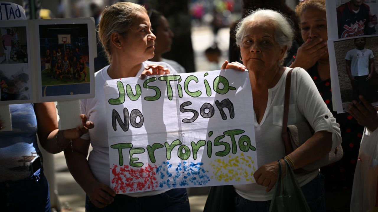 Women hold a sign claiming justice during a rally to demand the release of youngsters captured during protests after the disputed July 31 presidential election at the Public Prosecutor's Office in Caracas on September 26, 2024. (Photo by Federico PARRA / AFP) (Photo by FEDERICO PARRA/AFP via Getty Images)