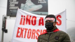 A man attends a rally during a strike by public transport companies in Lima on September 26, 2024. Thousands of buses ground to a halt in Lima on September 26, in an unusual protest against extortion from gangs, a racket that has become the bane of citizens' existence in Latin America. (Photo by ERNESTO BENAVIDES / AFP) (Photo by ERNESTO BENAVIDES/AFP via Getty Images)