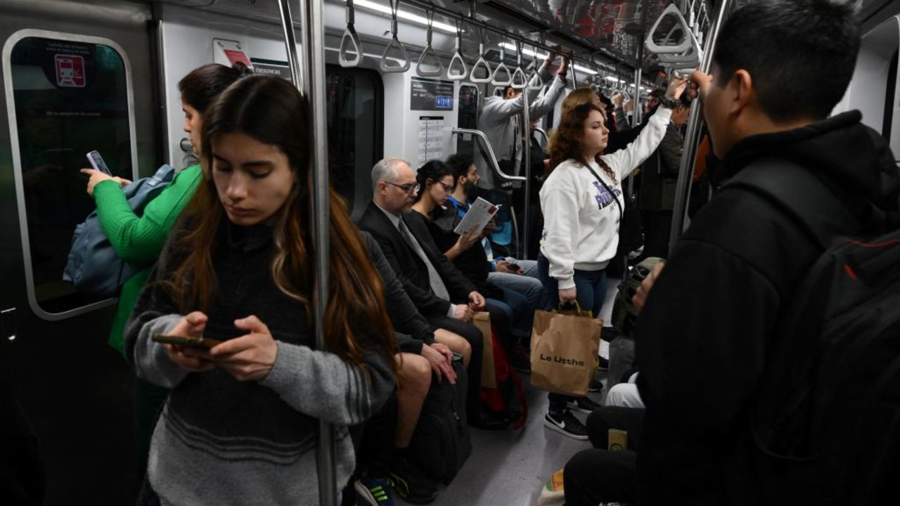 People ride the subway in Buenos Aires on September 26, 2024. Poverty in Argentina reached 52,9 percent of the population in the first six months of Javier Milei's government, reflecting the impact of the 50 percent devaluation carried out in December and a fiscal adjustment policy that, focused on reducing spending and inflation, deepened the economic recession. (Photo by LUIS ROBAYO / AFP) (Photo by LUIS ROBAYO/AFP via Getty Images)