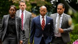 Eric Adams, mayor of New York, center right, and his lawyer Alex Spiro, center left, outside Gracie Mansion in New York, US, on Thursday, Sept. 26, 2024. New York City Mayor Eric Adams was indicted on bribery and fraud charges following a federal corruption investigation, calling into question the political future of the man in charge of running the biggest US city. Photographer: Victor J. Blue/Bloomberg