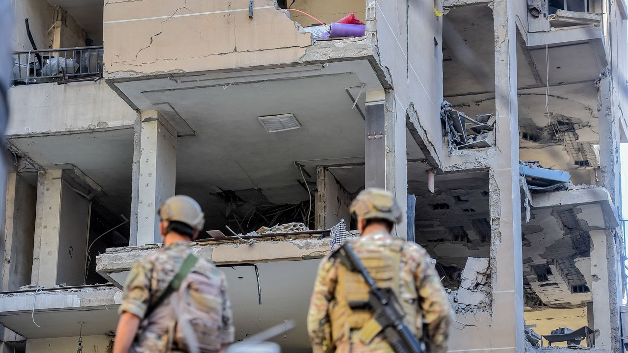 Lebanese soldiers stand guard at the site of an Israeli airstrike that targeted an apartment in Beirut's southern suburbs on September 26.