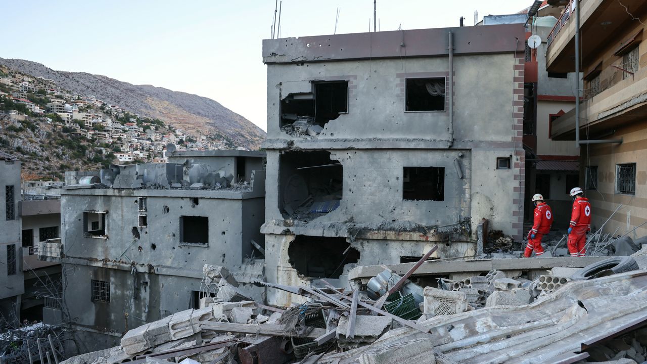 Rescuers check the destruction following an overnight Israeli airstrike in the southern Lebanese village of Shebaa on September 27.