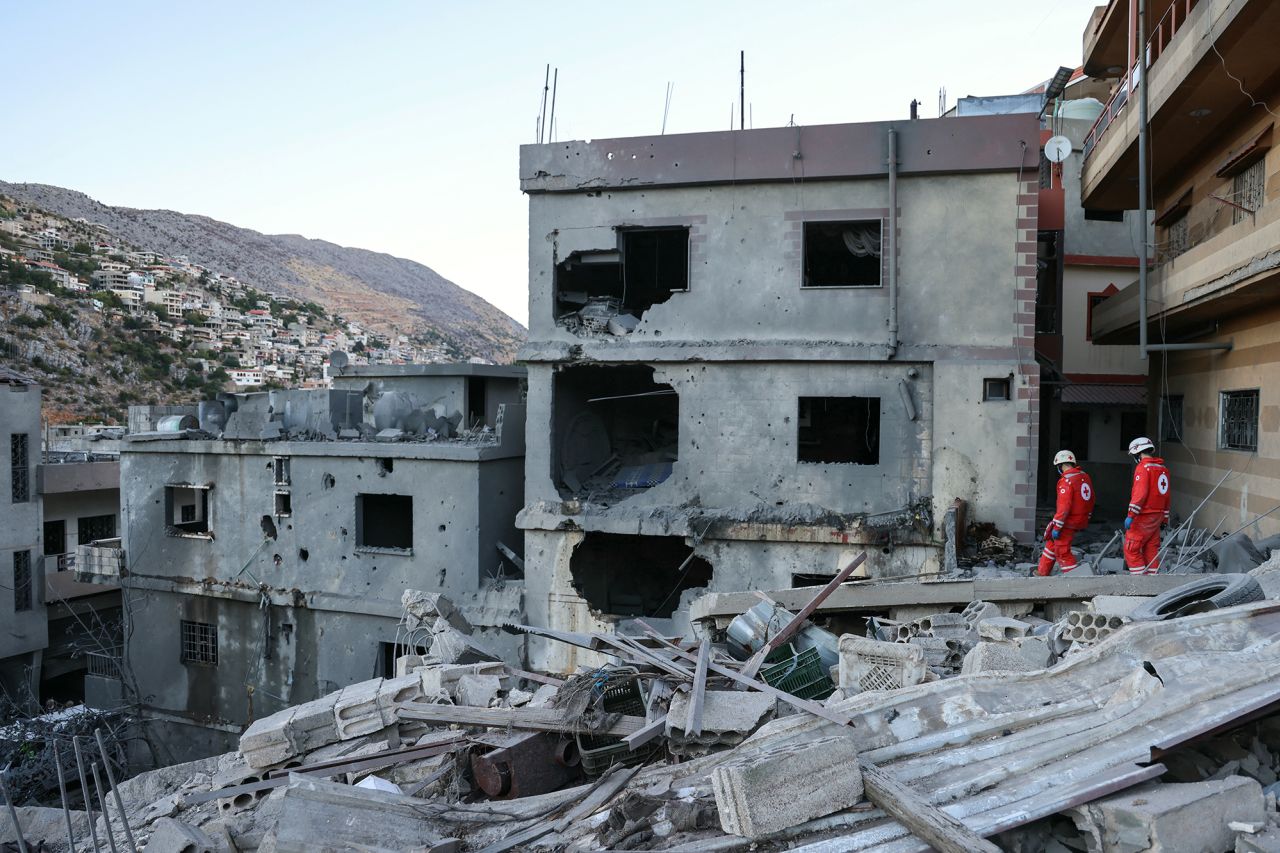 Rescuers check the destruction following an overnight Israeli airstrike in the southern Lebanese village of Shebaa on September 27.