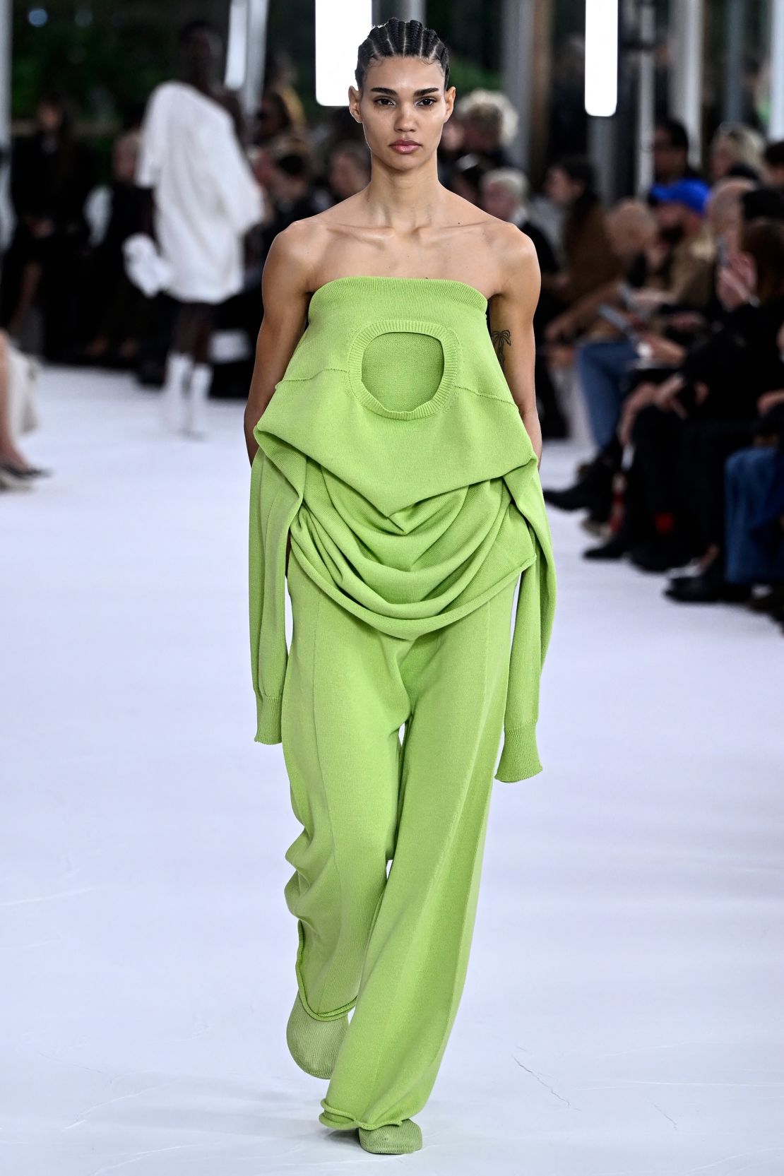 At Issey Miyake, sweaters were flipped and worn in alternative ways or even transformed into dresses. 