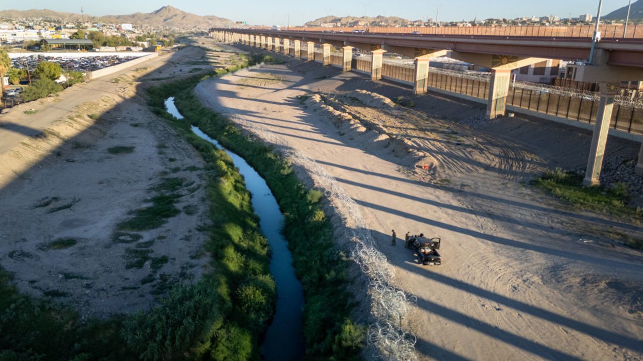 EL PASO, TEXAS - SEPTEMBER 18: From an aerial view Texas National Guard troops inspect razor wire lining the Rio Grande at the U.S.-Mexico border on September 18, 2024 in El Paso, Texas. Immigrant border crossings remain low months after the Biden Administration's executive order banning most asylum claims at the southern border. The issues of asylum and illegal immigration remain motivating topics for voters ahead of the upcoming U.S. presidential election. (Photo by John Moore/Getty Images)