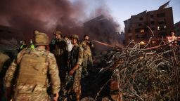 Lebanese army soldiers and people gather at the scene of Israeli air strikes in the Haret Hreik neighbourhood of Beirut's southern suburbs on September 27, 2024. A source close to Hezbollah said the massive Israeli strikes on Beirut's southern suburbs flattened six buildings. (Photo by Ibrahim AMRO / AFP) (Photo by IBRAHIM AMRO/AFP via Getty Images)