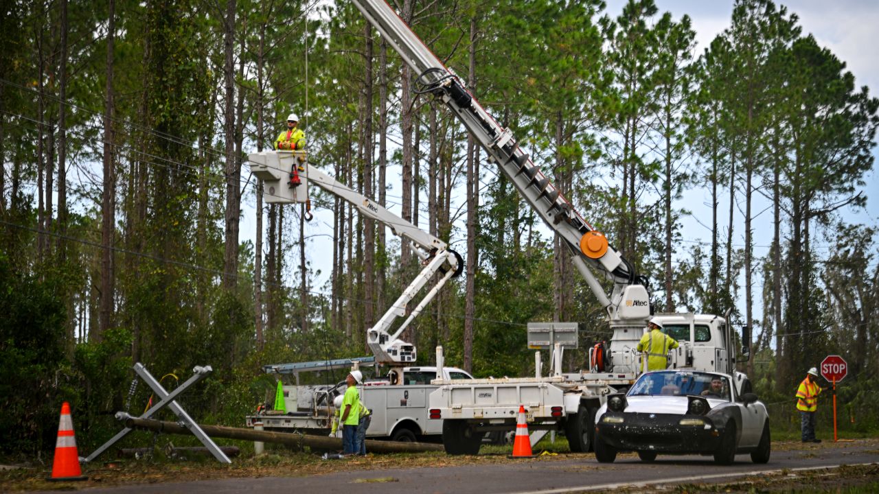 Workers attempt to restore power lines after Hurricane Helene made landfall in Keaton Beach, Florida, on September 27.