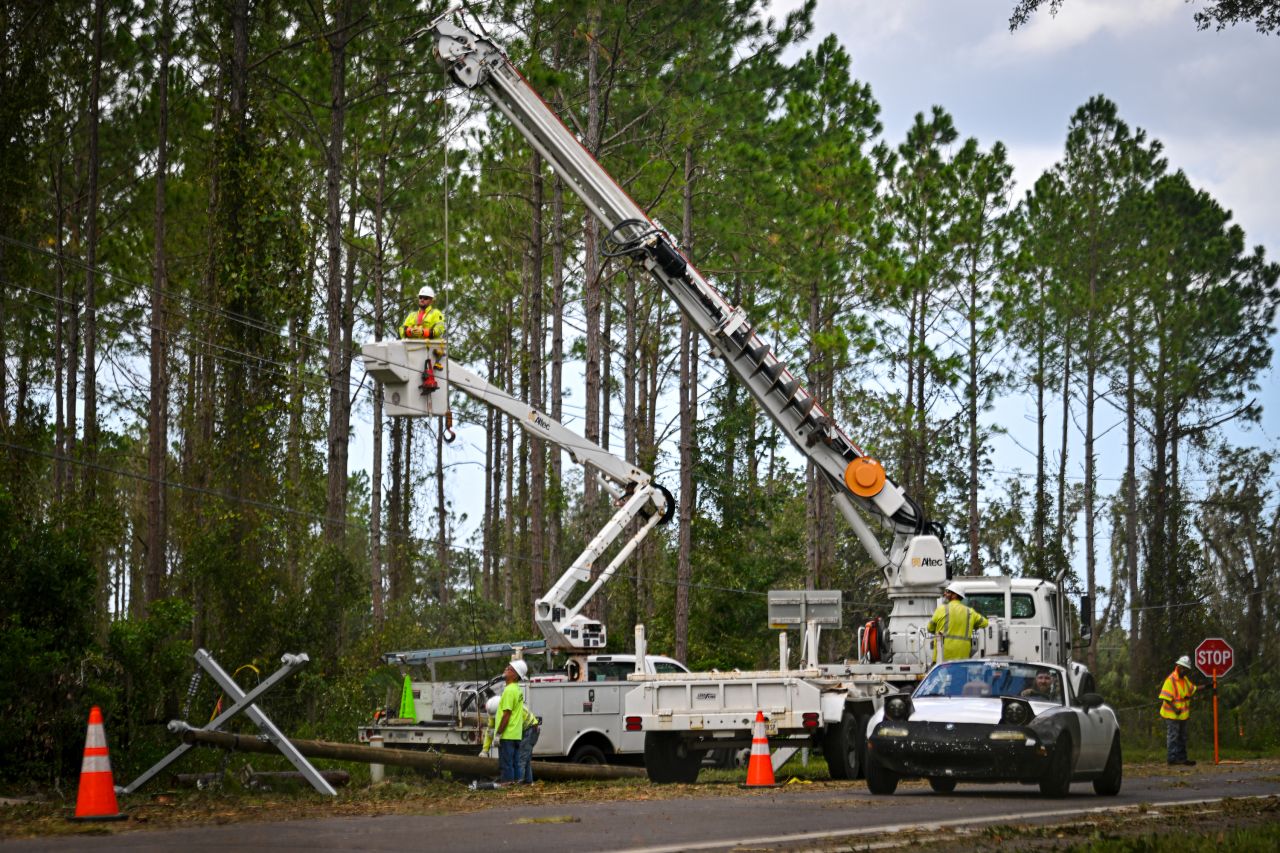 Workers attempt to restore power lines after Hurricane Helene made landfall in Keaton Beach, Florida, on September 27.