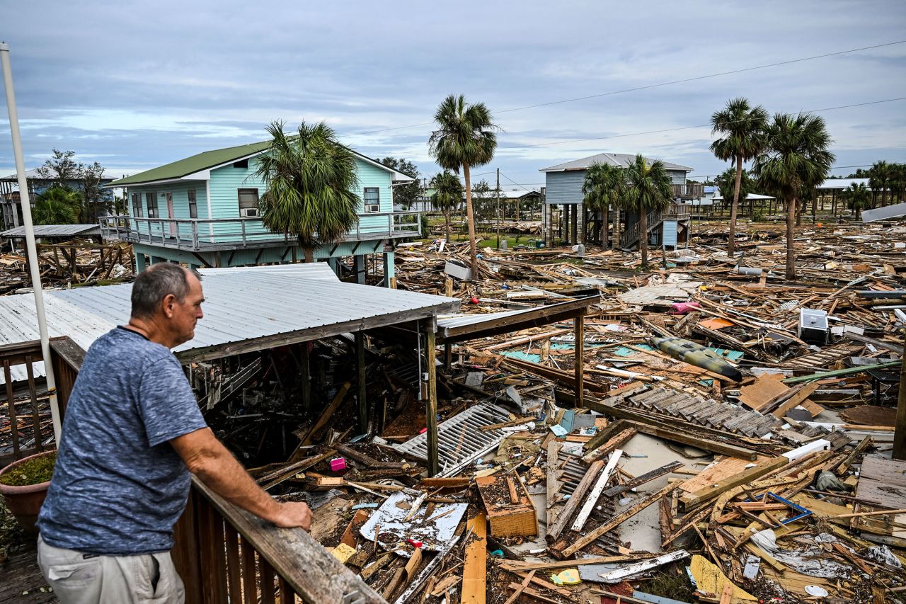 A man inspects damage to his house after Hurricane Helene made landfall in Horseshoe Beach, Florida, on September 28.