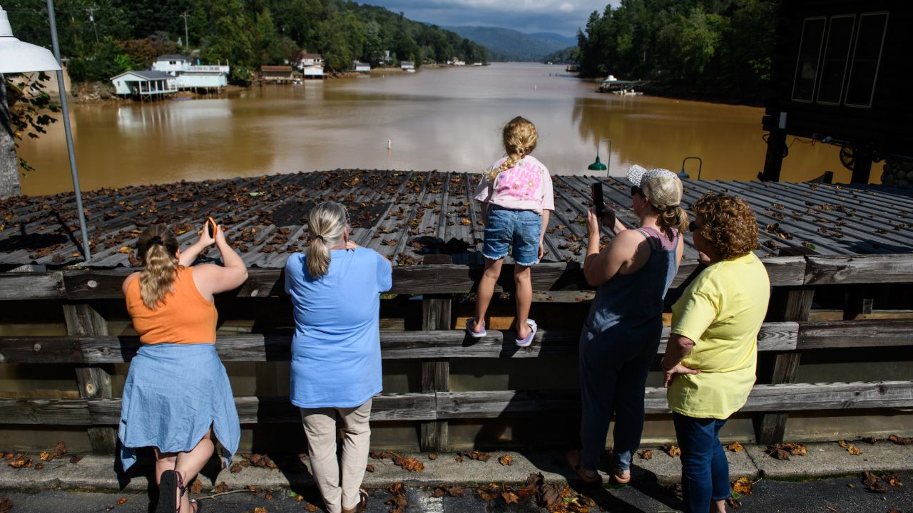 People look at flood damagenear Lake Lure, North Carolina on September 28.