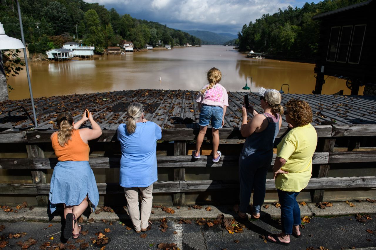 People look at flood damagenear Lake Lure, North Carolina on September 28.