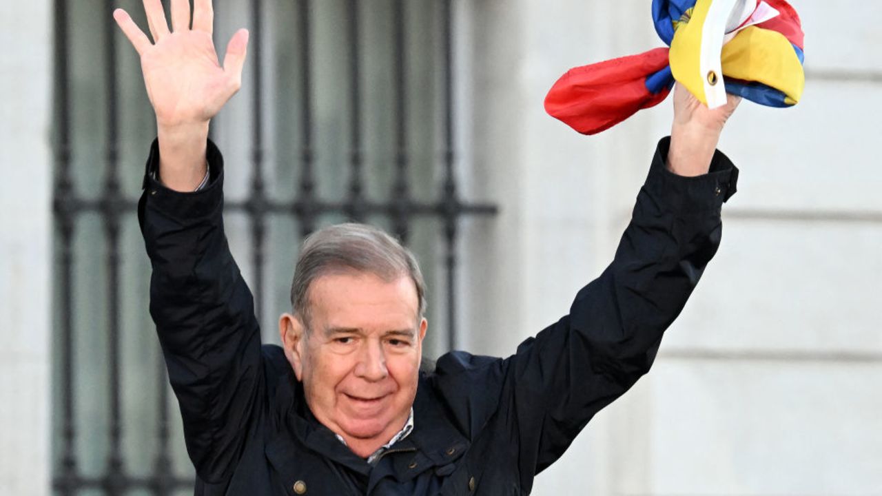 Venezuelan opposition presidential candidate Edmundo Gonzalez Urrutia waves from the stage during a demonstration after a call for global protests against the results of the disputed election in Venezuela, on September 28, 2024 in Madrid. The Venezuelan opposition presidential candidate, Edmundo Gonzalez Urrutia, made a brief appearance today, without speaking, at a demonstration in Madrid demanding recognition of his victory in the July 28 elections. Two months after those elections, in which the opposition claims there was fraud to give President Nicolas Maduro the victory, several thousand people gathered in Puerta del Sol square in Madrid, a place of exile for numerous opposition figures. (Photo by JAVIER SORIANO / AFP) (Photo by JAVIER SORIANO/AFP via Getty Images)