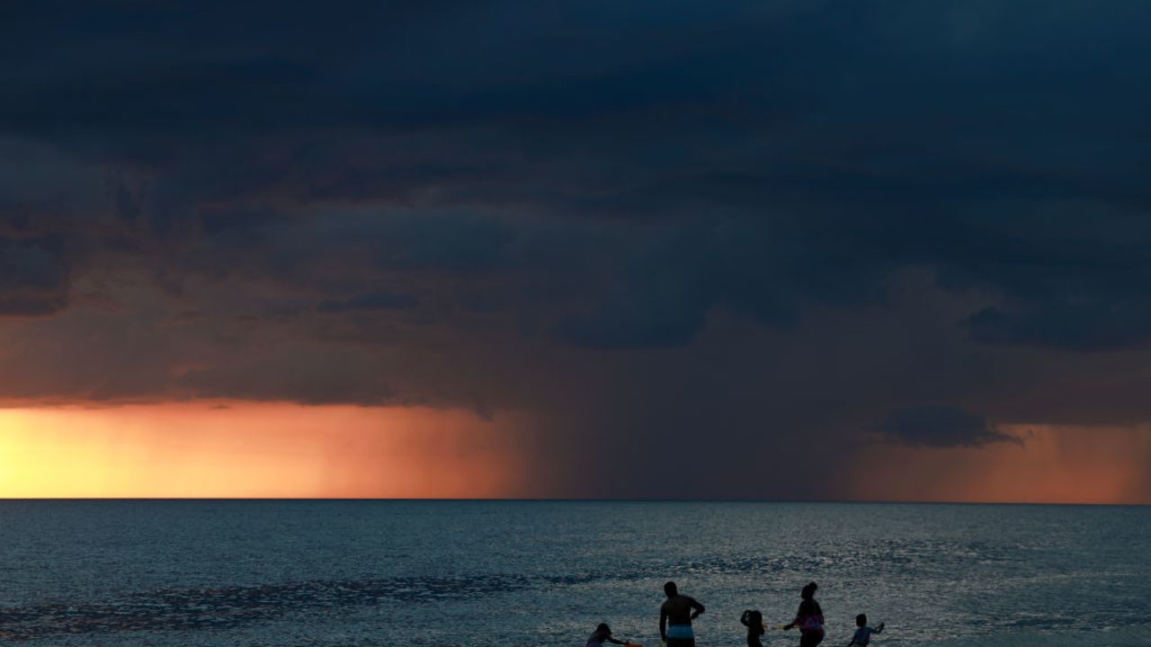 ST. PETE BEACH, FLORIDA - SEPTEMBER 2: Storm clouds are seen on the horizon as the sun sets on September 24, 2024 in St. Pete Beach, Florida. Tropical Storm Helene is forecast to become a major hurricane, bringing a potential for deadly storm surge, flooding rain, and destructive hurricane-force winds along parts of the Florida West coast. Helene is expected to make landfall in Florida on Thursday. (Photo by Joe Raedle/Getty Images)