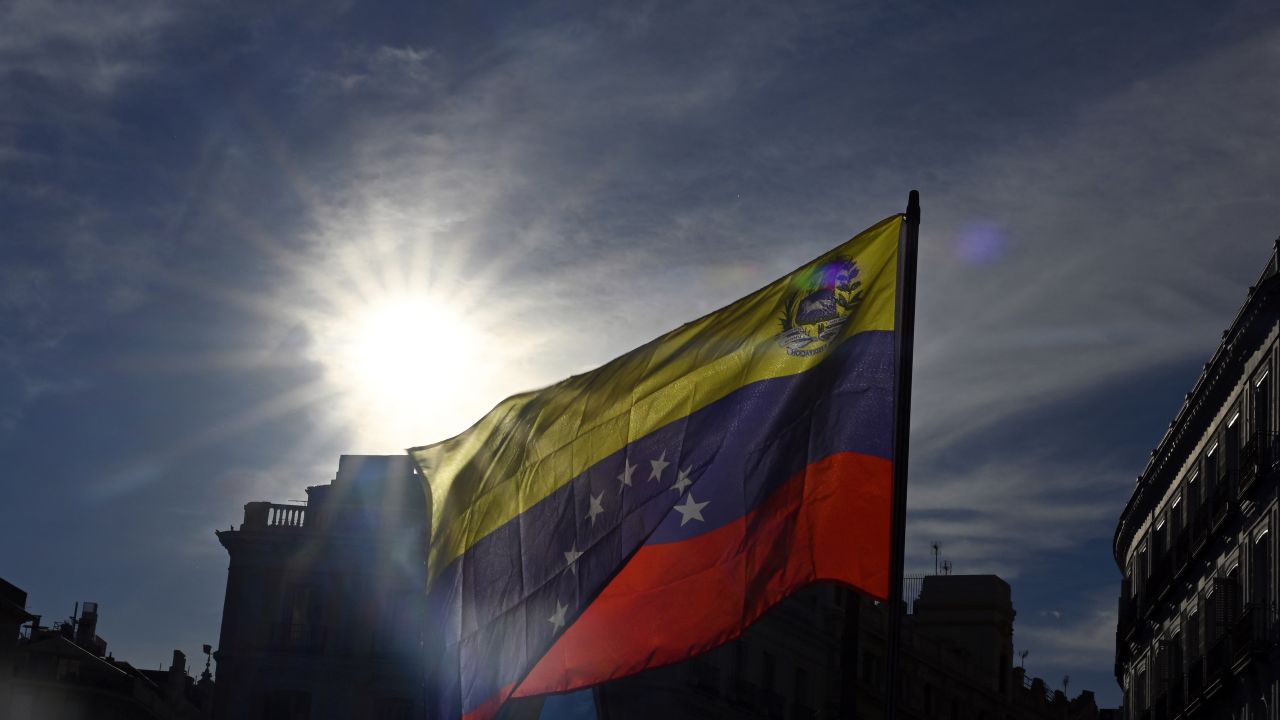 Protesters wave Venezuelan flags during a demonstration after a call for global protests against the results of the disputed election in Venezuela, on September 28, 2024 in Madrid. (Photo by JAVIER SORIANO / AFP) (Photo by JAVIER SORIANO/AFP via Getty Images)