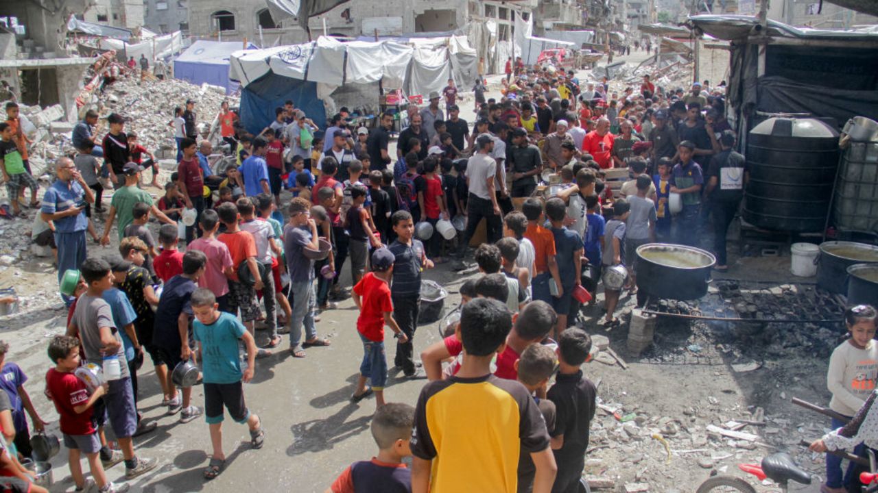 Displaced Palestinians form a long queue to receive food, distributed by a charity organization at Jabalia refugee camp in Gaza City, Gaza on September 23, 2024. (Photo by Mahmoud Issa / Middle East Images / Middle East Images via AFP) (Photo by MAHMOUD ISSA/Middle East Images/AFP via Getty Images)