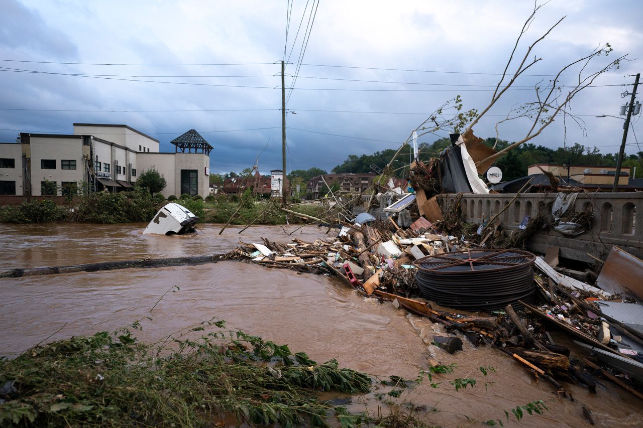 A van sits in floodwaters near the Biltmore Village in Asheville, North Carolina, on Saturday.