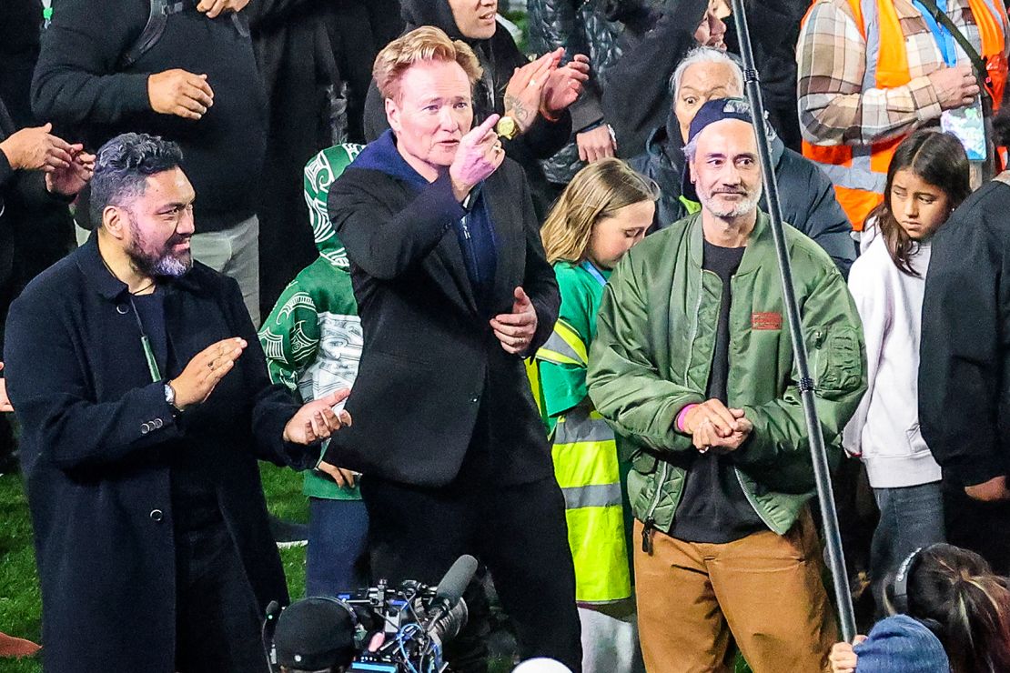 New Zealand filmmaker-actor Taika Waititi, second from right, and US TV host Conan O'Brien, second from left, at Eden Park in Auckland on September 29, 2024.