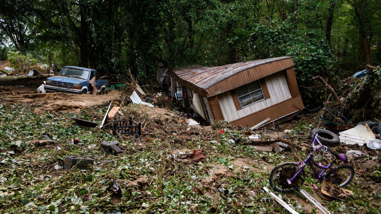 Debris and a mobile home are piled up along a tree line in Old Fort, North Carolina on September 29.