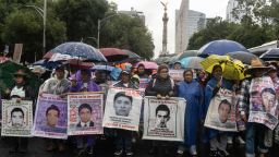 MEXICO CITY, MEXICO - SEPTEMBER 26: Parents of missing students protest on Paseo de la Reforma during a speech to  the 43 missing students from Ayotzinapa on September 26, 2024 in Mexico City, Mexico. On the night of September 26, 2014 a group of students from the Isidro Burgos Rural School gathered in the city of Iguala, in the Southern state of Guerrero, prior the commemoration of the Tlatelolco massacre. The students hold and take buses to be transported for later being chased and attacked by local police groups ed by other security forces including the federal police and the army. The result was the dissapearance of 43 students belonging to the rural school who until today are seeked by relatives and friends. (Photo by Cristopher Rogel Blanquet/Getty Images)