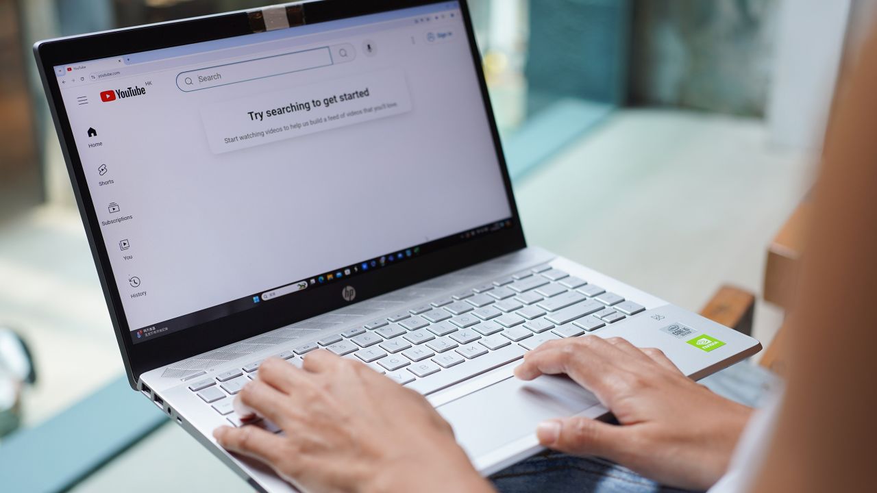 2024/09/29: In this photo illustration, A woman browses Youtube website on her laptop.