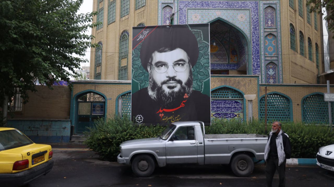 A billboard bearing a picture of Lebanon's Hezbollah leader Hassan Nasrallah, who was killed in an Israeli air strike on Beirut's southern suburbs on September 27, is displayed in Tehran on September 30, 2024. (Photo by ATTA KENARE / AFP) (Photo by ATTA KENARE/AFP via Getty Images)