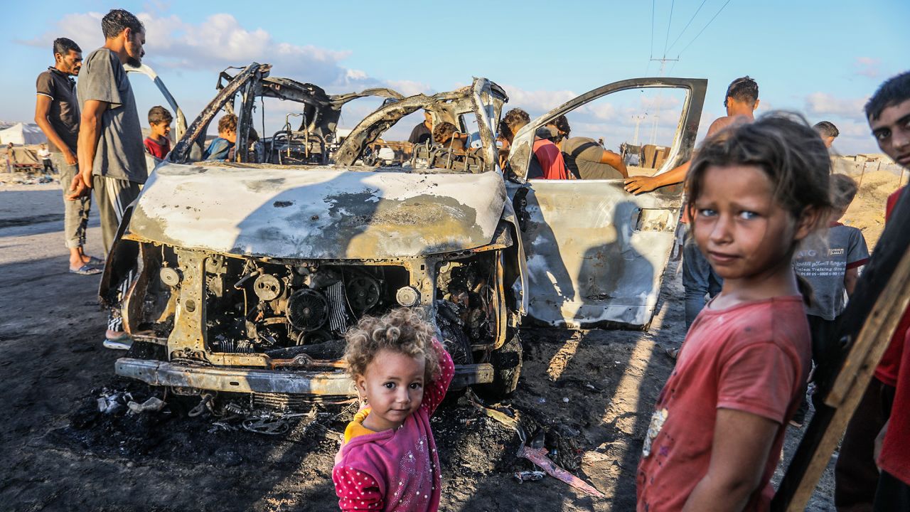 Palestinians inspect a vehicle destroyed following an Israeli attack in Khan Younis, Gaza on September 30.